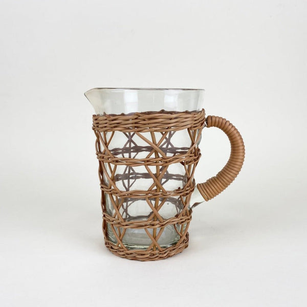 A rattan pitcher perfect for outdoor dining.