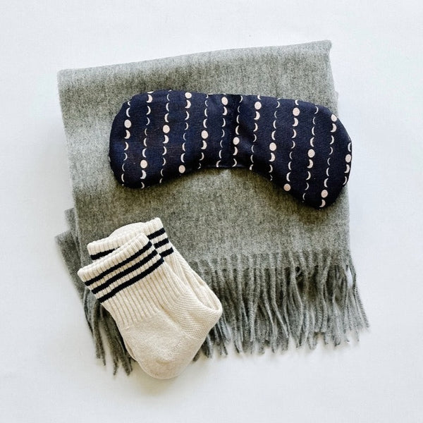 Tbco gray scarf paried with a slow north eye mask and le bon shoppe socks.