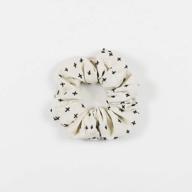 White and navy scrunchie from Anchal.