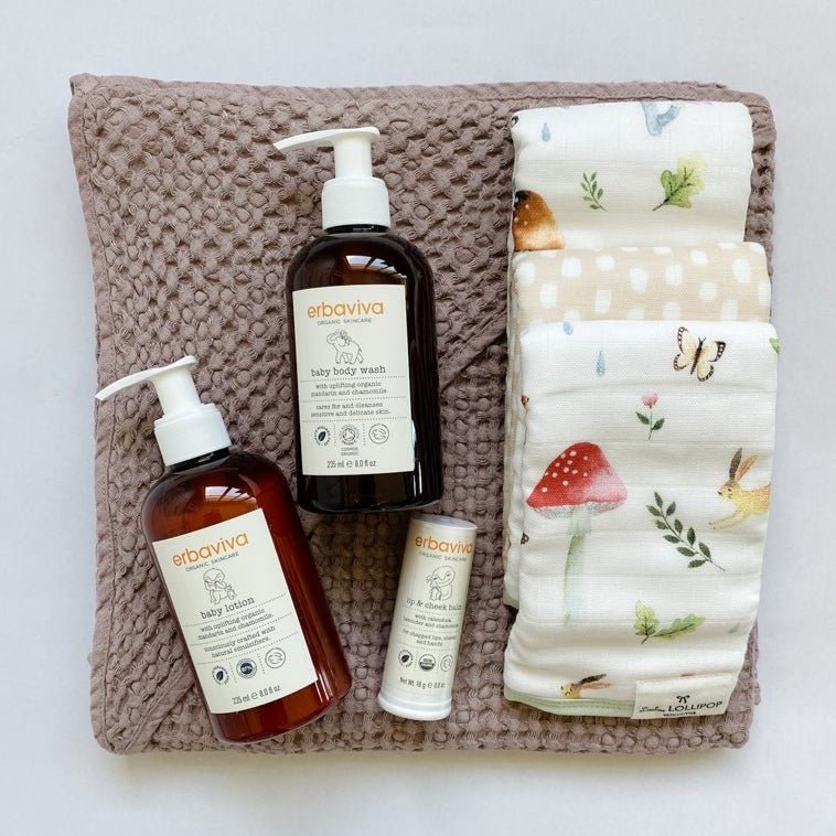 Newborn gift with Loulou Lollipop washcloths in wooden gnome and erbaviva baby body lotion and wash.