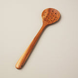 A beautiful wooden strainer spoon from Be HOME.