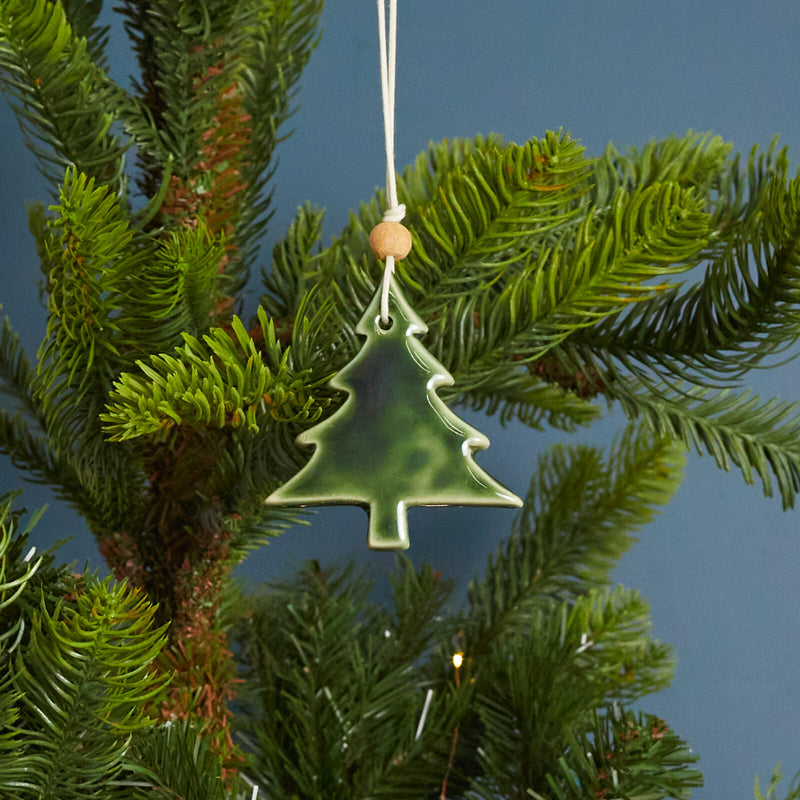 Metallic Green Stoneware tree ornament. The perfect topper to any present.