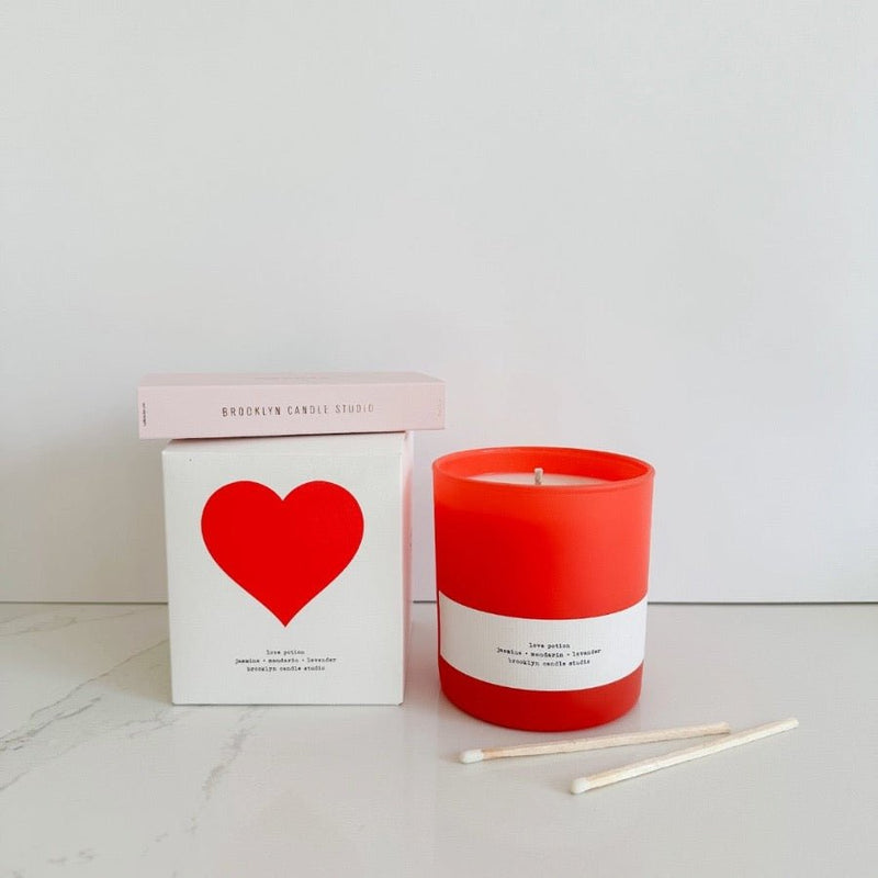 Brooklyn Candle Studio limited edition love potion candle in red glass with XOXO long matches.