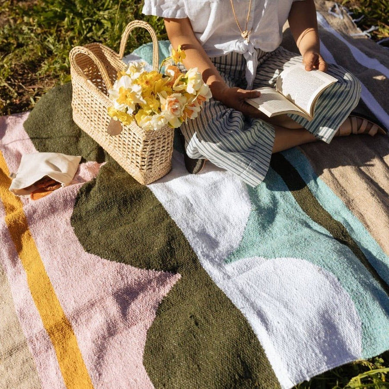 Picnic perfect, this Caminito blanket is a must have for Spring picnics, soccer games, or days at the beach.
