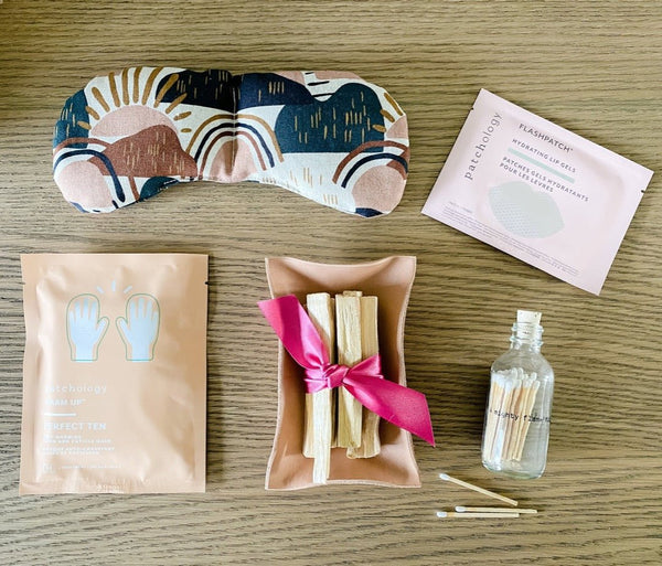 Great care package featuring eye mask, hand mask, palo santo and lip gels.