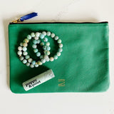 Certain Standard pouch paired with etoilled bracelets and poppy & pout lip balm.
