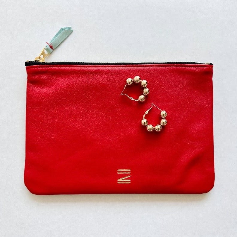 Certain Standard red leather pouch paired iwth shashi paloma earrings for a great gift.