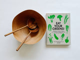 Eat Your Greens book paired with a gorgeous wood bowl and salad servers. Perfect gift for the salad lover in your life.