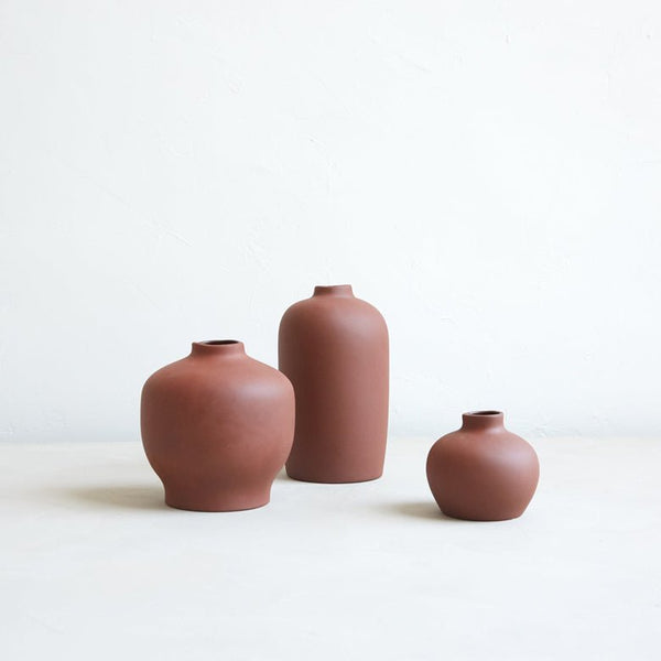 Floral Society ceramic bud vases in earth brown.