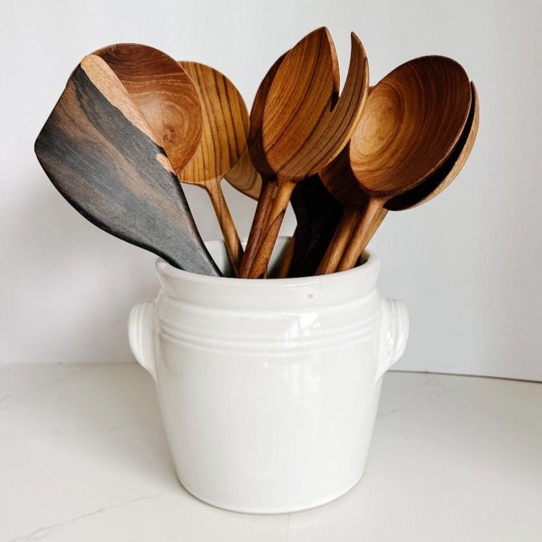 Ceramic crock from French Dry Goods featuring a collection of gorgeous wood spoons and servers.