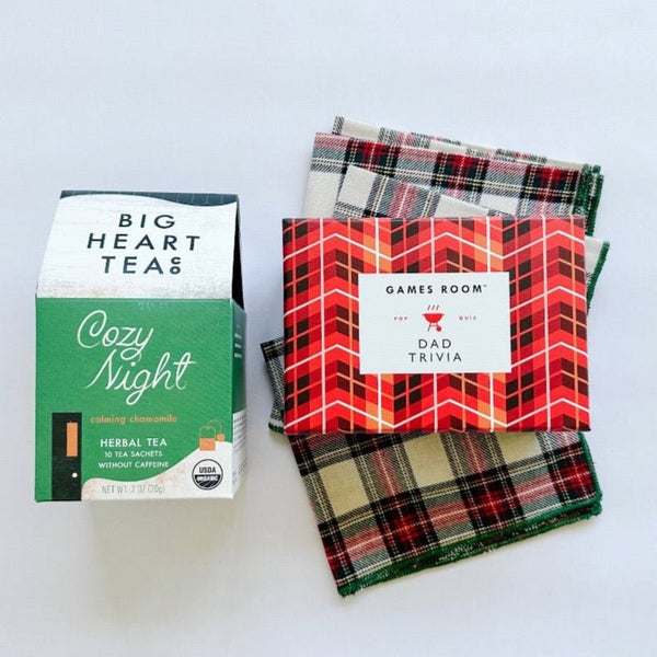Dad Trivia paired with cozy night tea and festive tartan table linens. A perfect treat for dad.