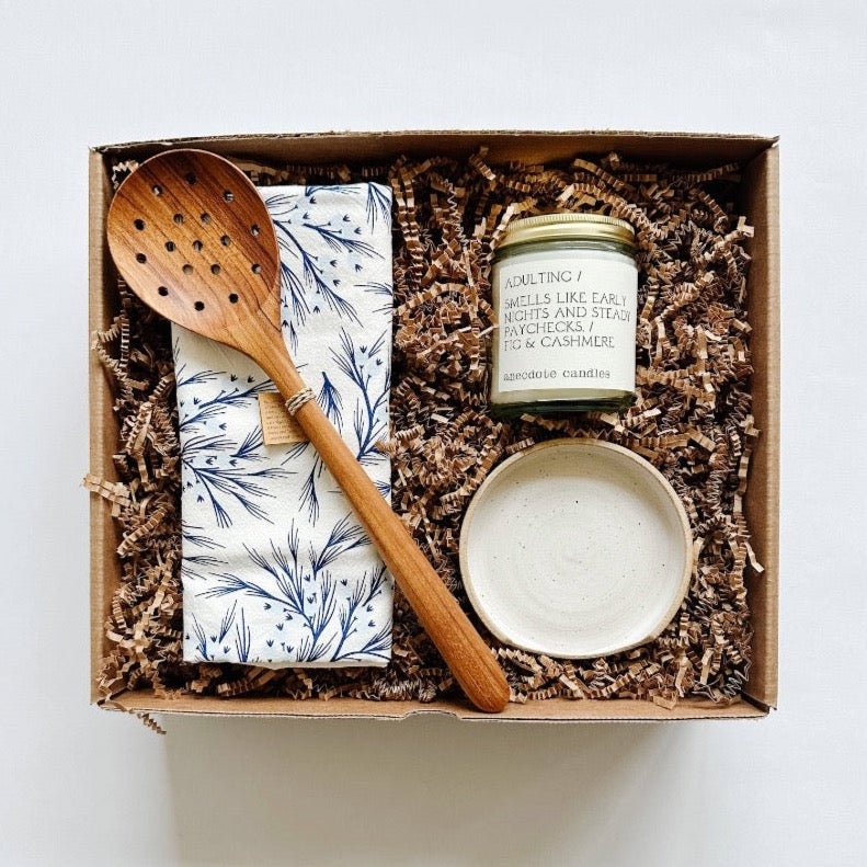 Beautiful wood spoon and handmade spoon rest paired with a winter tea towel and candle. 