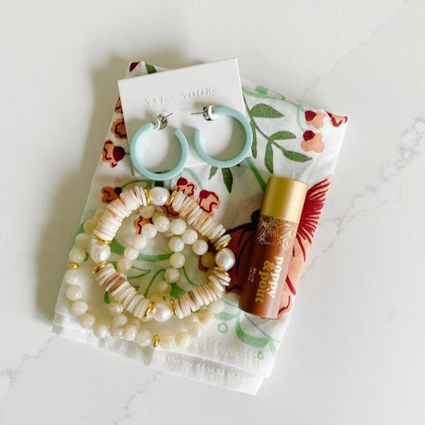 Hemlock goods bandana with Nat & Noor earrings, pretty Etoiled bracelets and Poppy & Pout Lip Tint.
