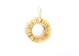 Fringed hoop ornament from Kazi.  Perfect on top of any holiday gift.
