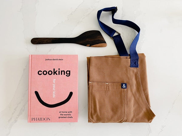 Apron, Cooking for your kids cookbook and Itzawood spatula.  Great combo from East Third Collective.