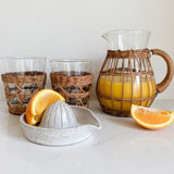 Enjoy a perfect morning with rattan pitcher and tumblers, with a handmade juicer. Great host gift.