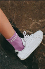 Purple socks shown on model.