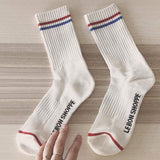 White boyfriend sock with blue and red stripe.