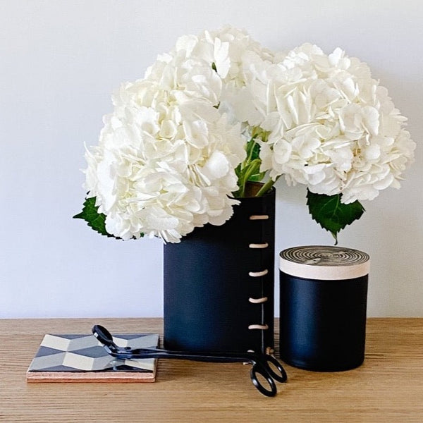 Made Solid xs vase in black with balsam candle and tile coasters