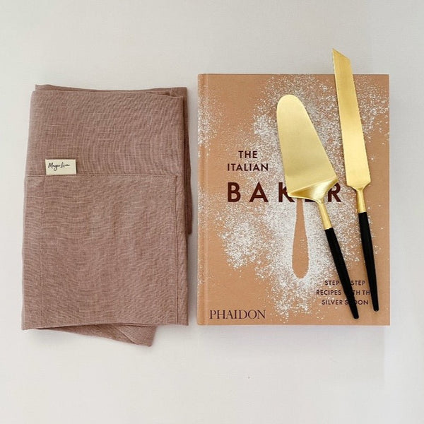 Magic Linen apron paired with The Italian Bakery cookbook and beautiful cake lift serving set.