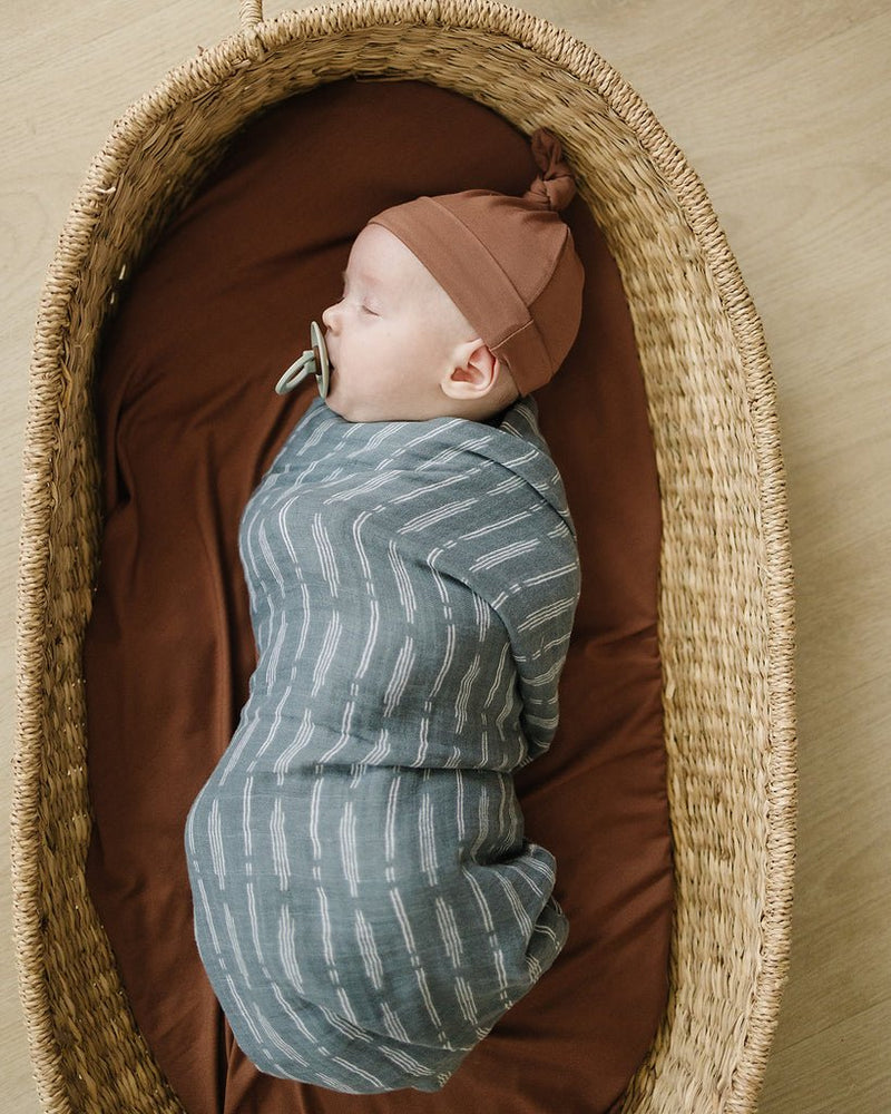Swaddle your newborn baby up in this cozy Mebie Baby blanket from East Third Collective gifting.