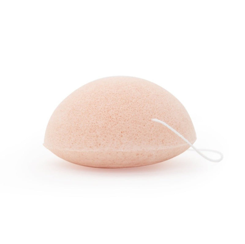 A pink beauty sponge from Milk + Honey used for removing makeup and impurities.
