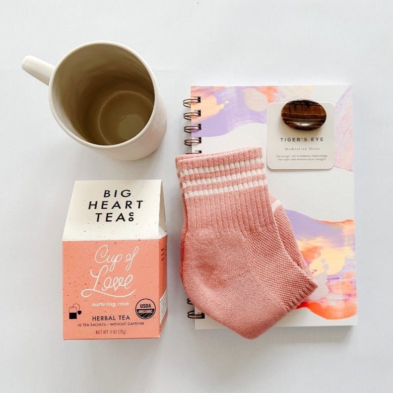 Moglea notepad paired with cute socks, tea, tiger's eye meditation stone and a cute mug make this a completely adorable gift.