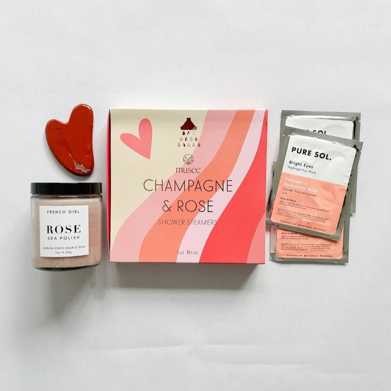 Champagne and Rose shower steamers, heart-shaped gua sha, rose sea polish and eye gels are a romantic gift that any girl would love.
