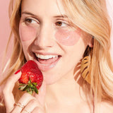 Woman wearing eye gets and eating a strawberry.  Great teen girl gift.