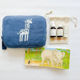 Sweet giraffe travel blanket paired with erbaviva bath products and Hug book for the sweetest baby gift ever.