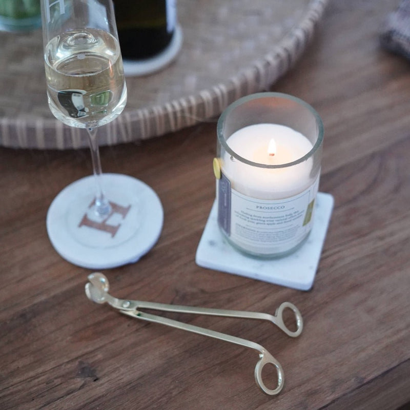 A perfect addition to your candle gift: A gold wick trimmer from Rewined.