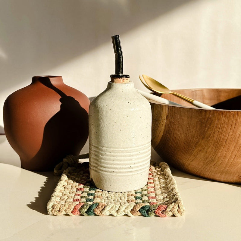 She Made ceramic olive oil cruet paired with beautiful handwoven potholder and Floral Society vase.