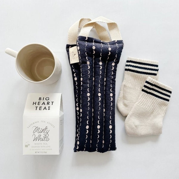 Slow north neck wrap paired with cloud socks, tea and stoneware mug for a thinking of you gift.