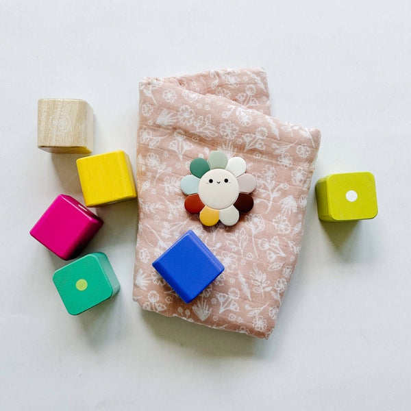 Tegu Baby's First Blocks with Mebie Baby wildflower swaddle and Loulou Lollipop Daisy Teether