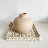 The Floral Society vase sitting atop a Kate Kilmurray handwoven potholder perfect for the nuetral kitchen.