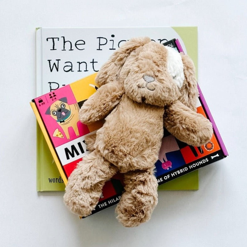 The Pigeon Wants a Puppy book paired with Mix the Mutts game and the cutest stuffed puppy dog.
