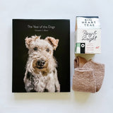 The Year of the Dogs book paired with Rosy and Bright tea and cozy socks are sure to brighten their day.