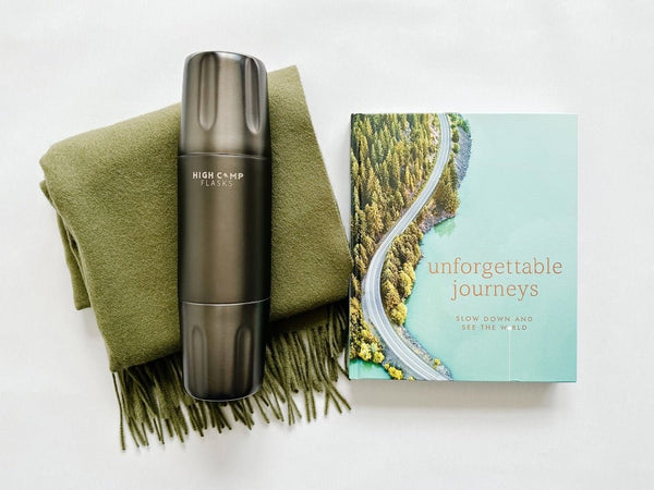 Unforgetable journeys book paired with a High Camp Flask and Tbco. travel scarf for the ulltimate adventurer.