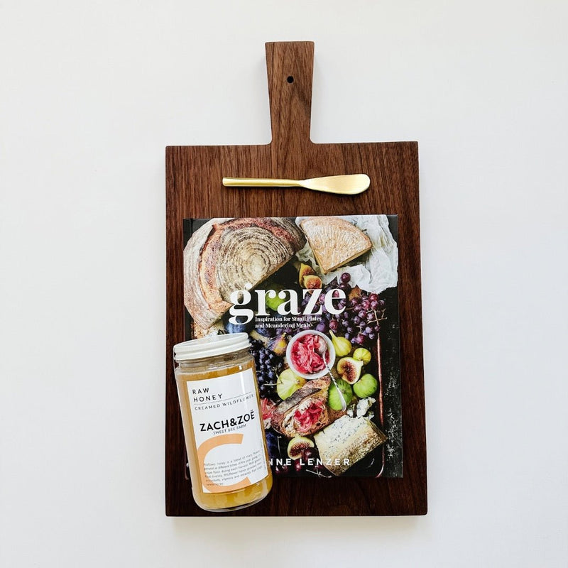 A beautiful board paired with Graze, our raw honey and a pretty gold spreader.