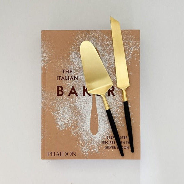 https://eastthirdcollective.com/cdn/shop/products/be-home-cake-knife-serving-set-italian-bakery-cookbook1-862096_600x.jpg?v=1695127074