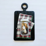 Beautiful black wood board paired with tartan cocktail napkins and camp craft cocktail mix makes a great host gift.