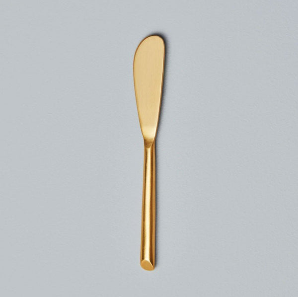 Be Home Matte gold spreader.  Pair this with any of our cutting boards for the perfect gift.