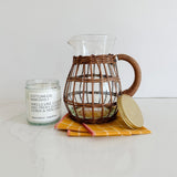 This fabulous rattan pitcher is paired with our bottomless mimosas candle and bright, cheery yellow cocktail napkins.