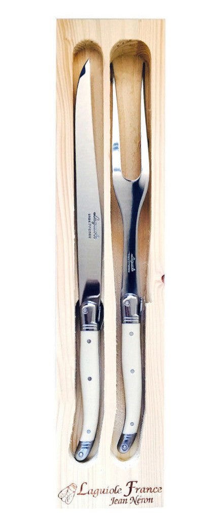 A custom wooden box holds the elegant ivory carving set from Laguoile and helps make it a stunning gift set for any home chef. 