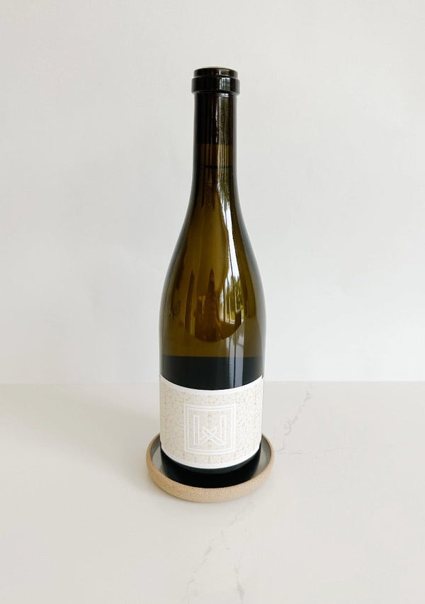 m.bueno dish featuring a bottle of Waylan Wine Co. wine. A great combination.