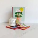Mezcal + Tequila cocktail recipe book makes the cutest host gift with this bottomless mimosa candle and Rainbow Sherbet cocktail napkins from Willow Ship.