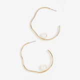 Salvador Earrings - elegant gold wavy hoops with mother of pearl baubles made by Shashi.