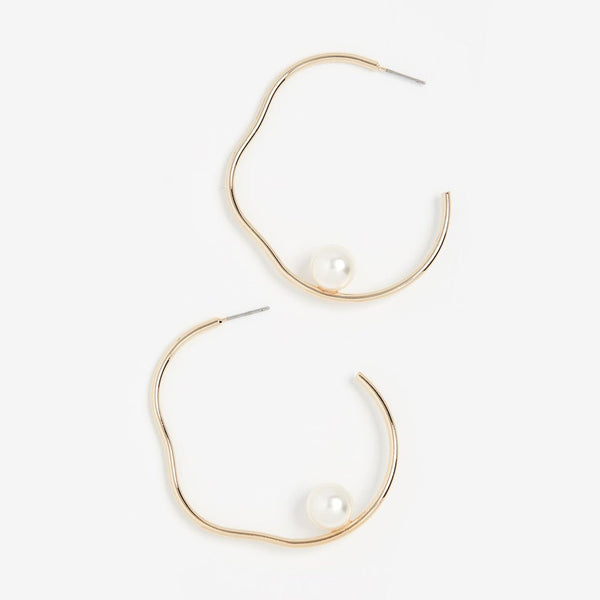 Salvador Earrings - elegant gold wavy hoops with mother of pearl baubles made by Shashi.