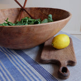 Small loop handled board from Sobremesa paired with a large salad bowl.