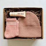 Tbco beanie paired iwth le bon shoppe socks and bkind hand balm for a color coordinated gift.